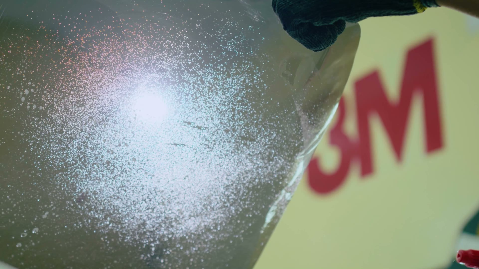 Film being squeegeed onto glass