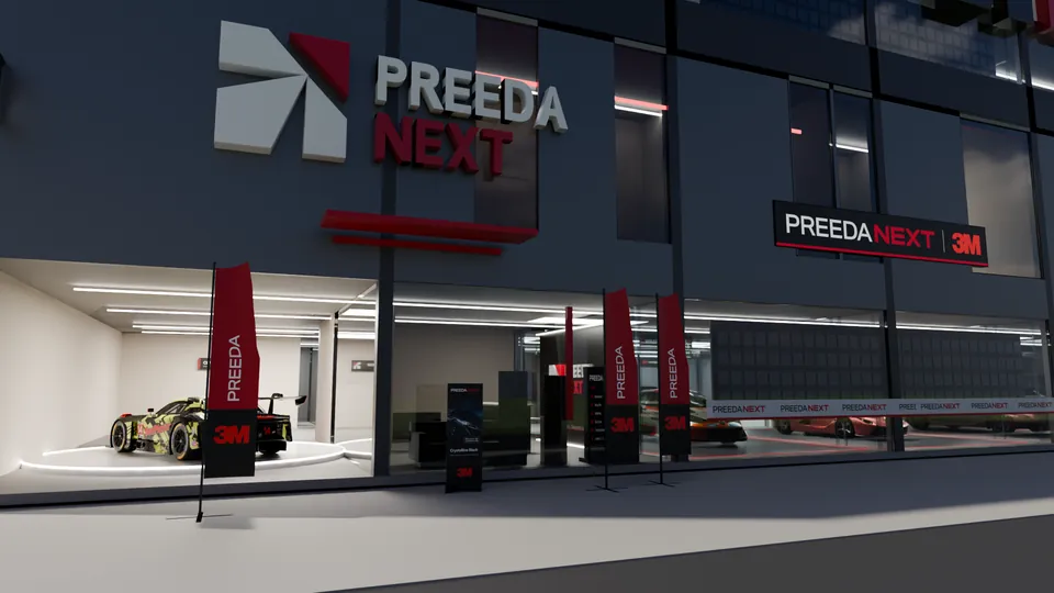 ทางเข้า PREEDA NEXT Experience Center ตอนกลางวัน ป้ายบนอาคารและรถในโชว์รูมชั้นล่าง